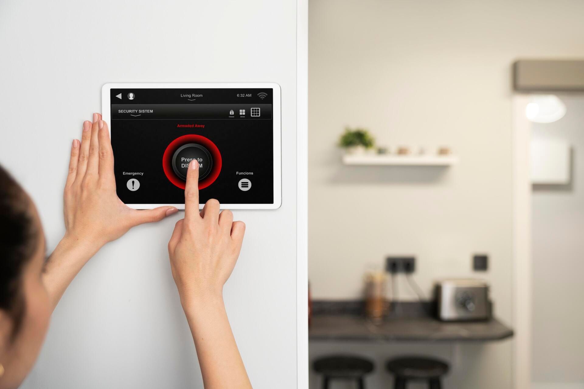 A woman is using a tablet to control a thermostat.