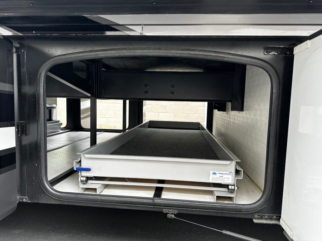 A rv with a drawer in the back of it.