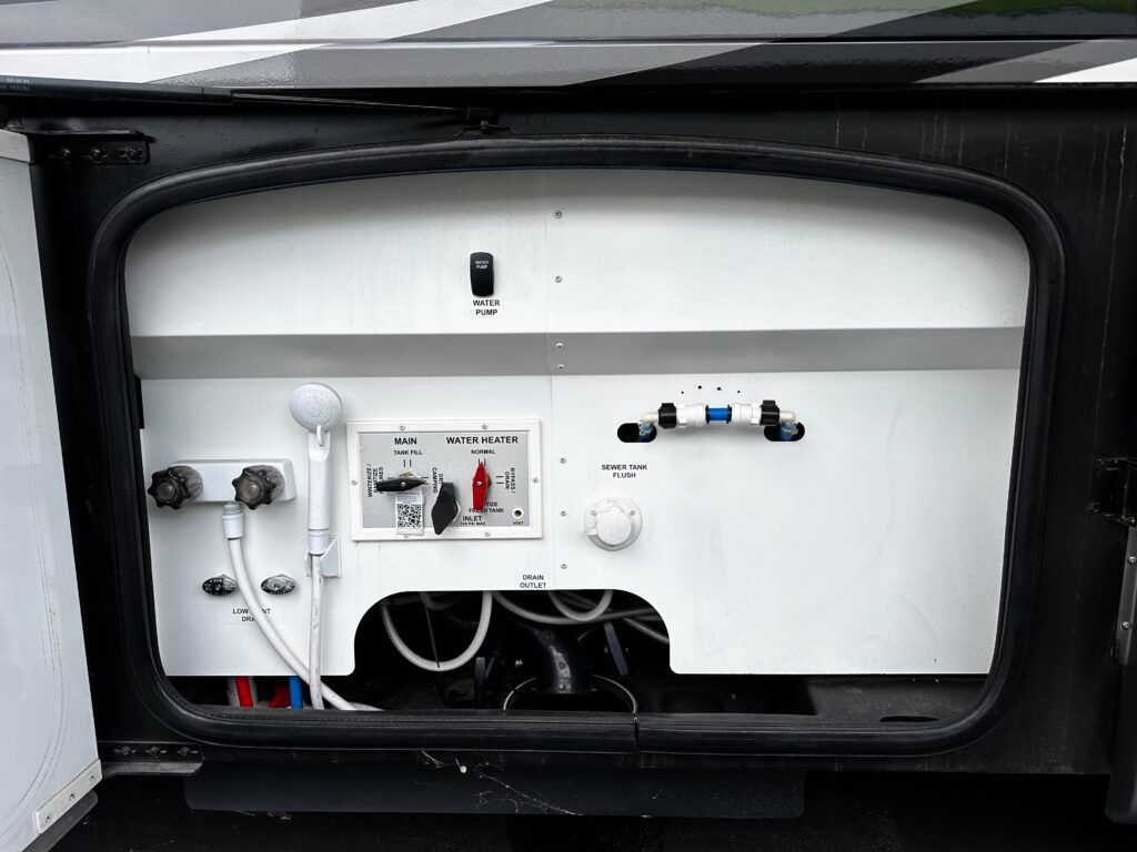 The inside of a camper with a shower and a switch