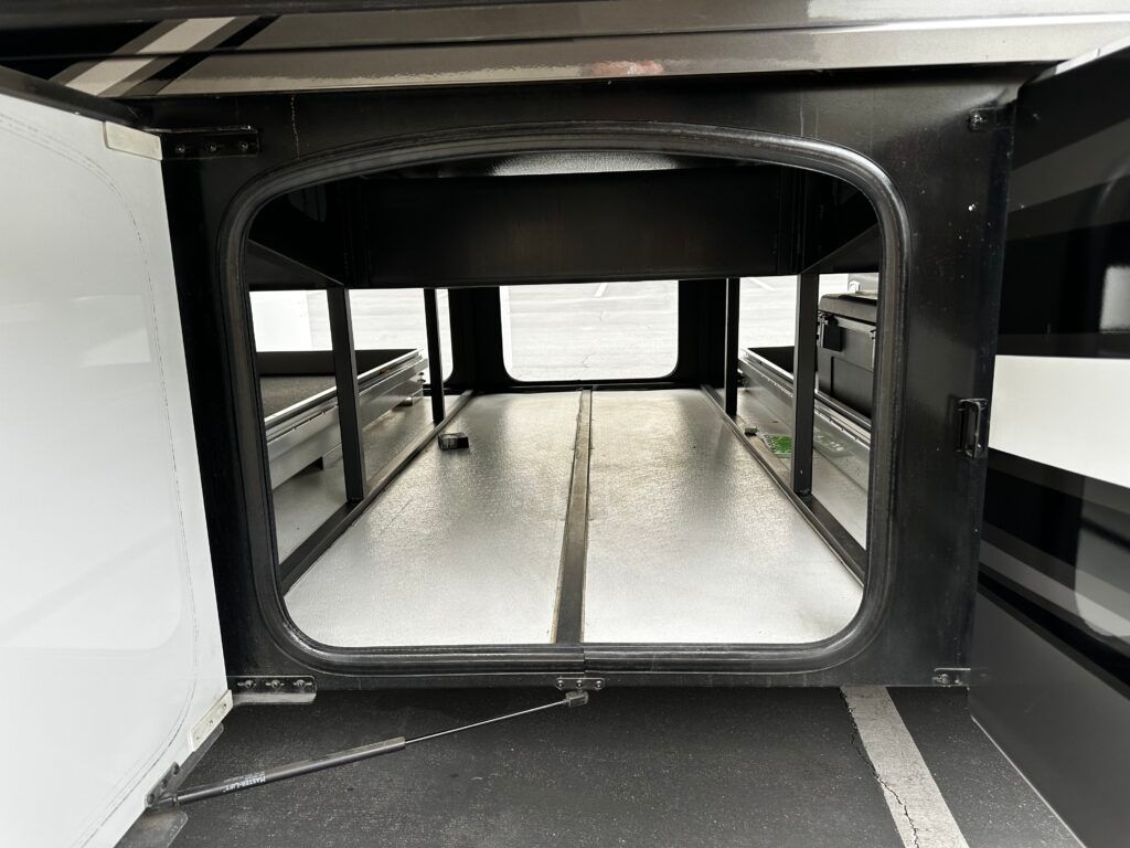 The inside of a trailer with the door open.