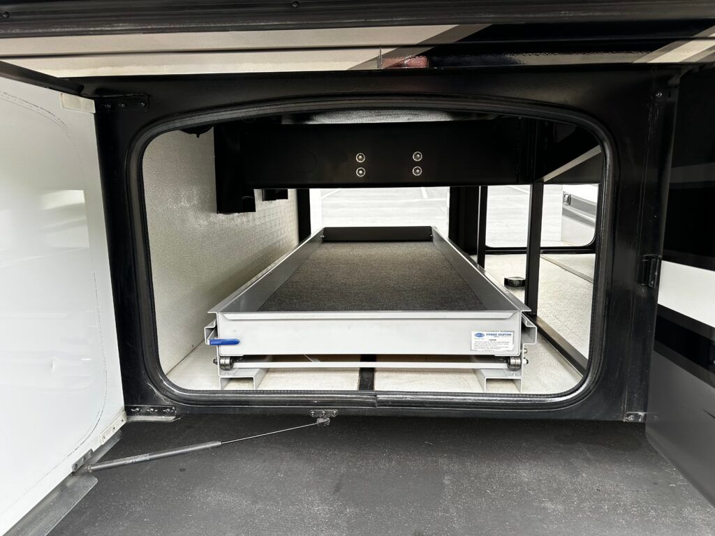 The inside of a trailer with a bed in it