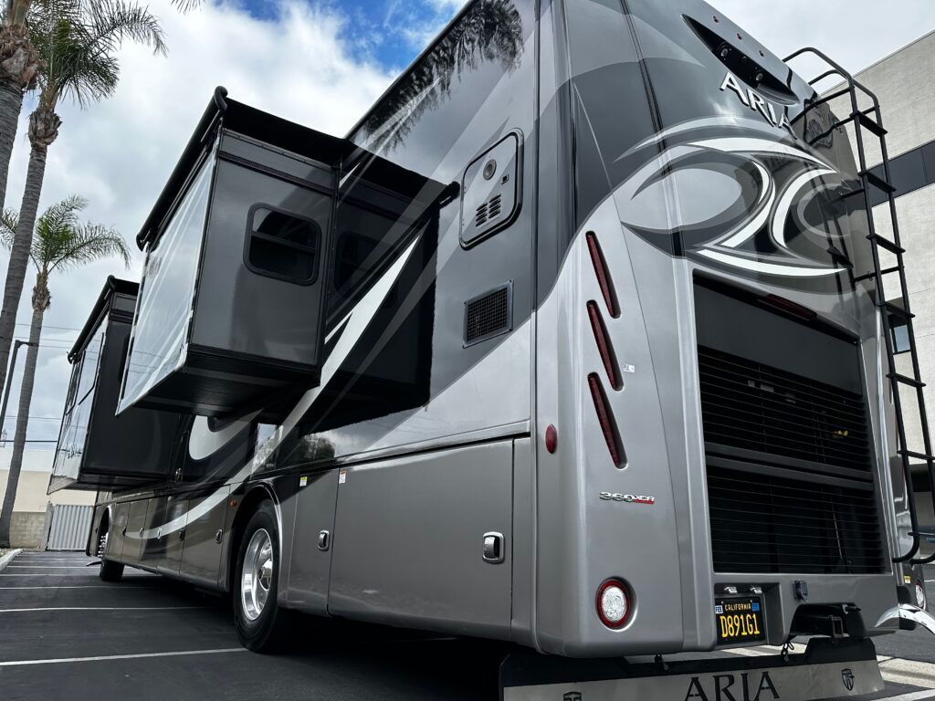 A large rv is parked in a parking lot.