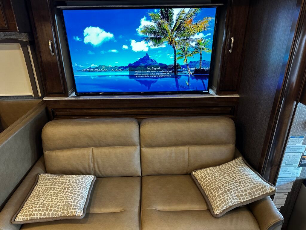 A living room with a couch and a flat screen tv