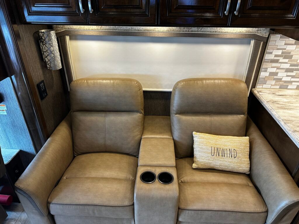 A couch with a pillow that says i 'm a wing on it