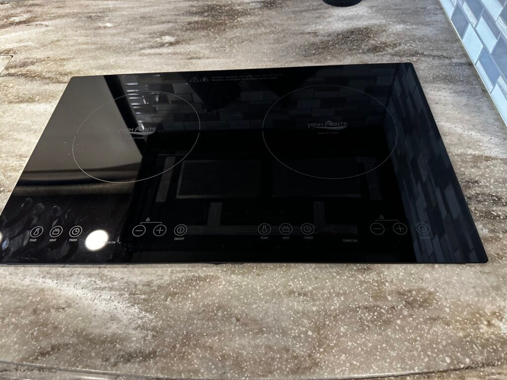 A black stove top oven is sitting on top of a counter.