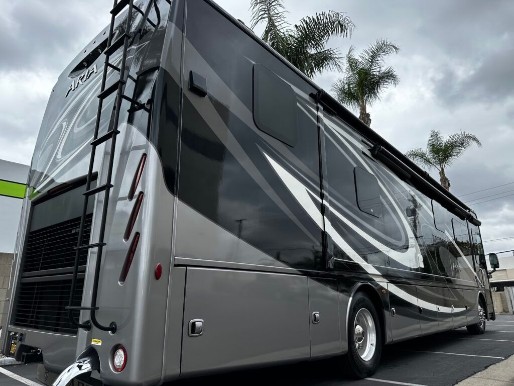 A large rv is parked in a parking lot.