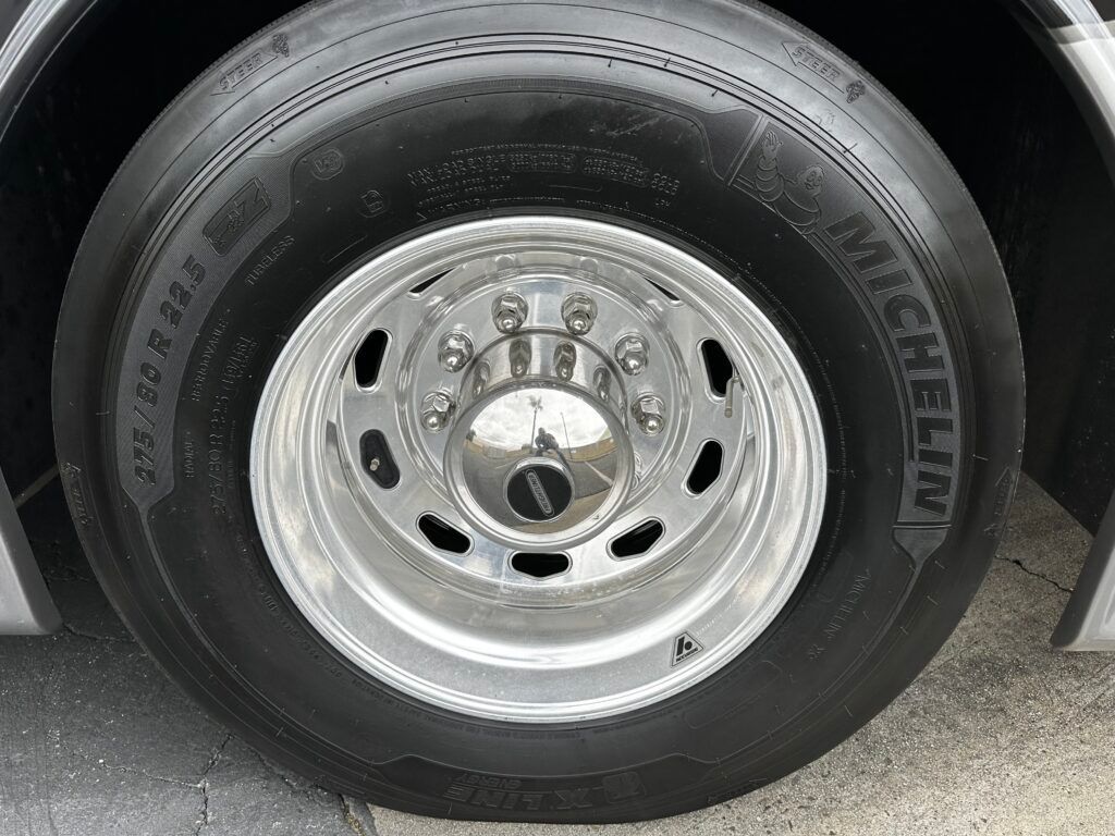 A close up of a michelin tire on a truck.