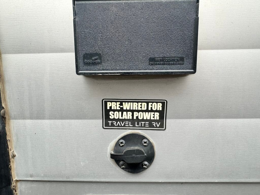 A sign on a wall that says pre-wired for solar power