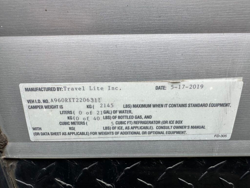 A metal item with a sticker on it that says ' warranty ' on it