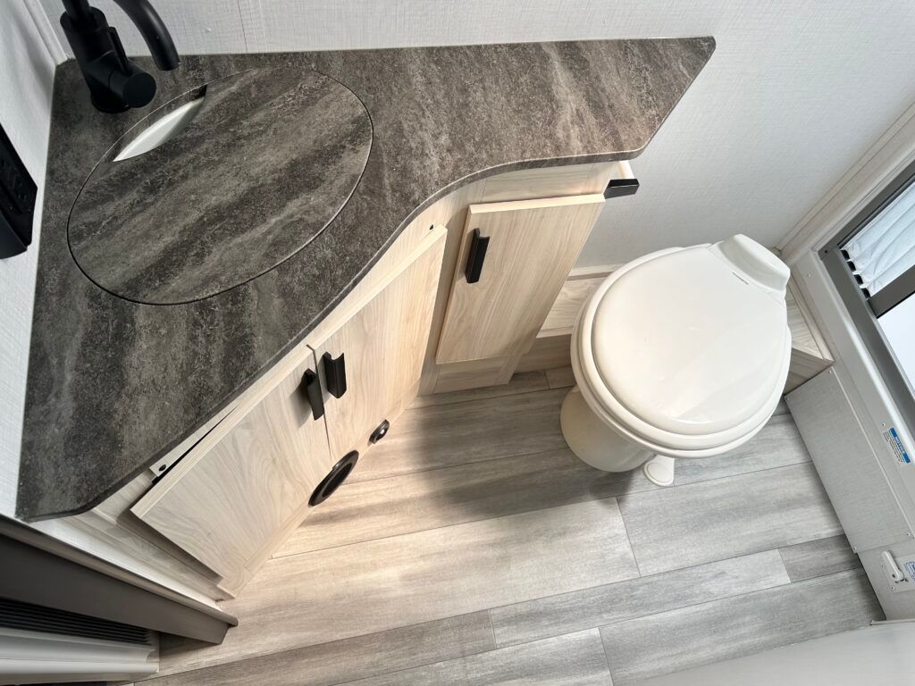 An aerial view of a bathroom with a toilet and sink.