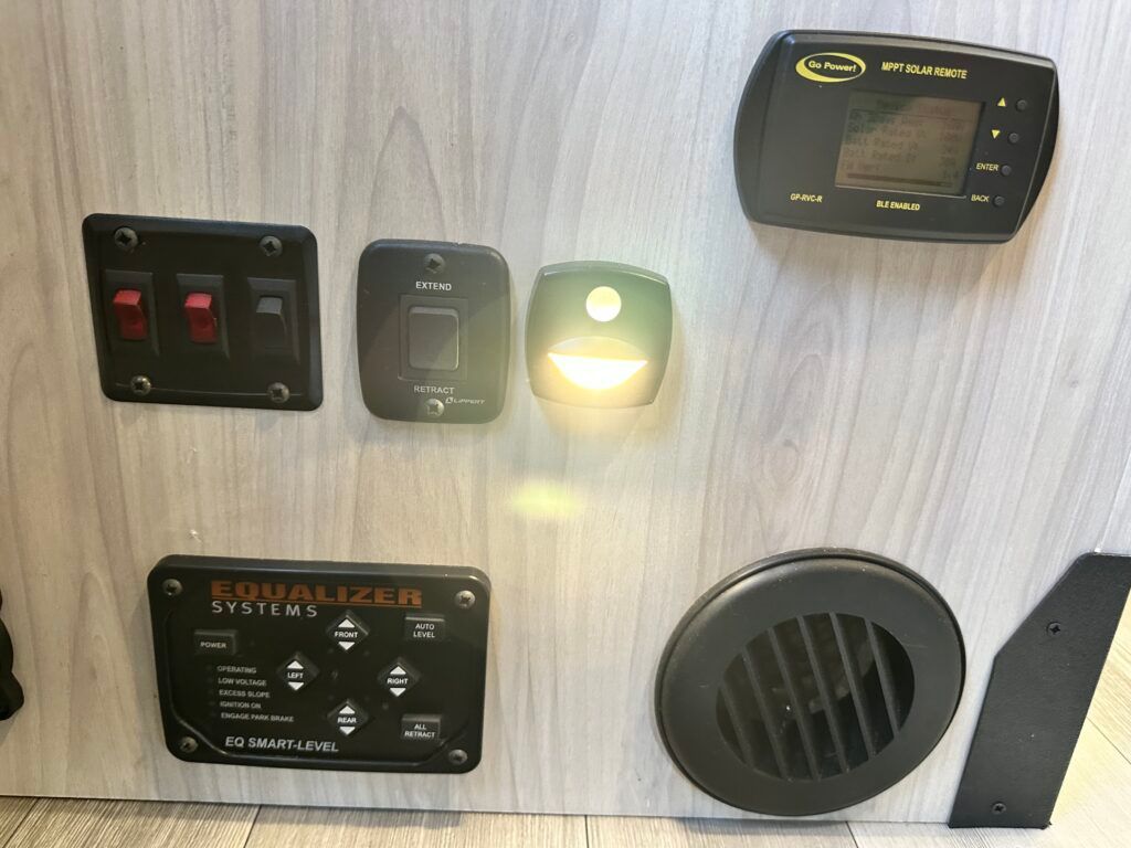 A wooden wall with a bunch of electronics on it