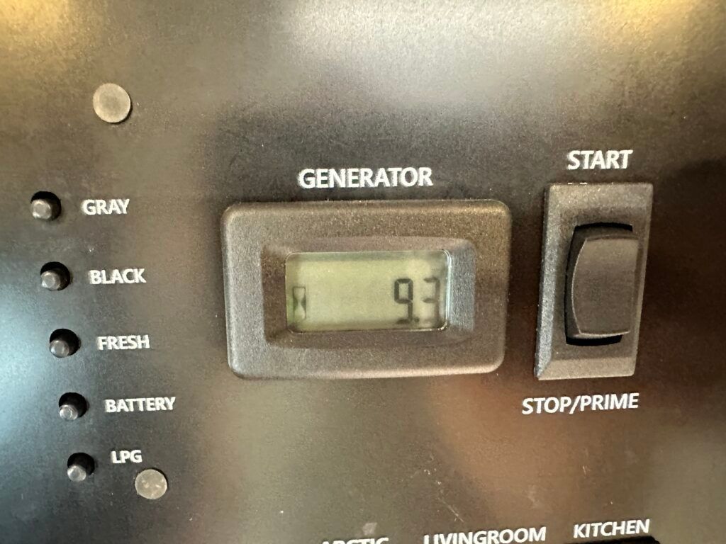 A black panel with a digital display that says generator on it.