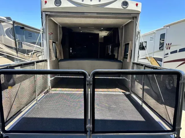 The back of a rv is shown with the door open.