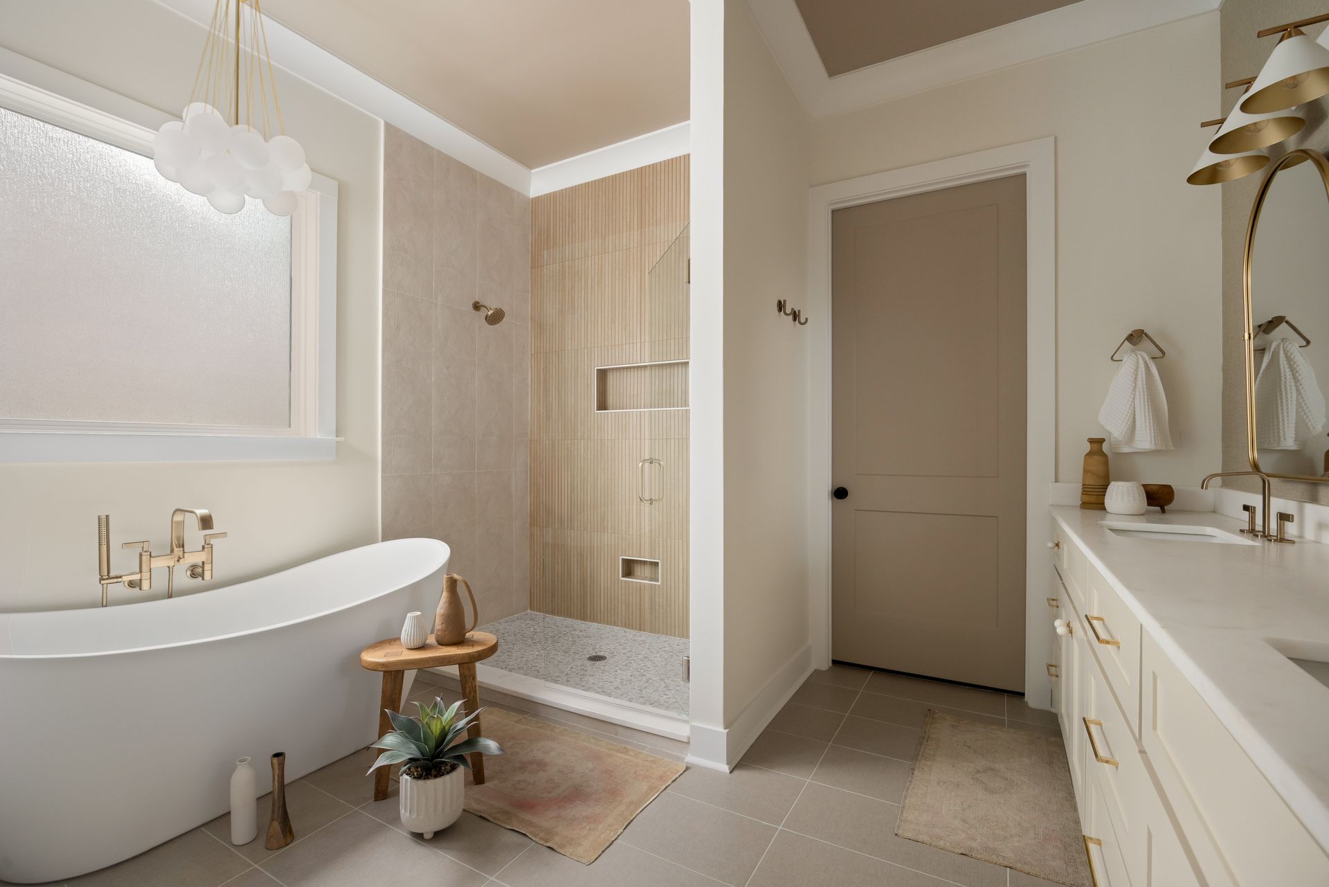Luxurious modern bathroom with a soaking tub and walk-in shower.