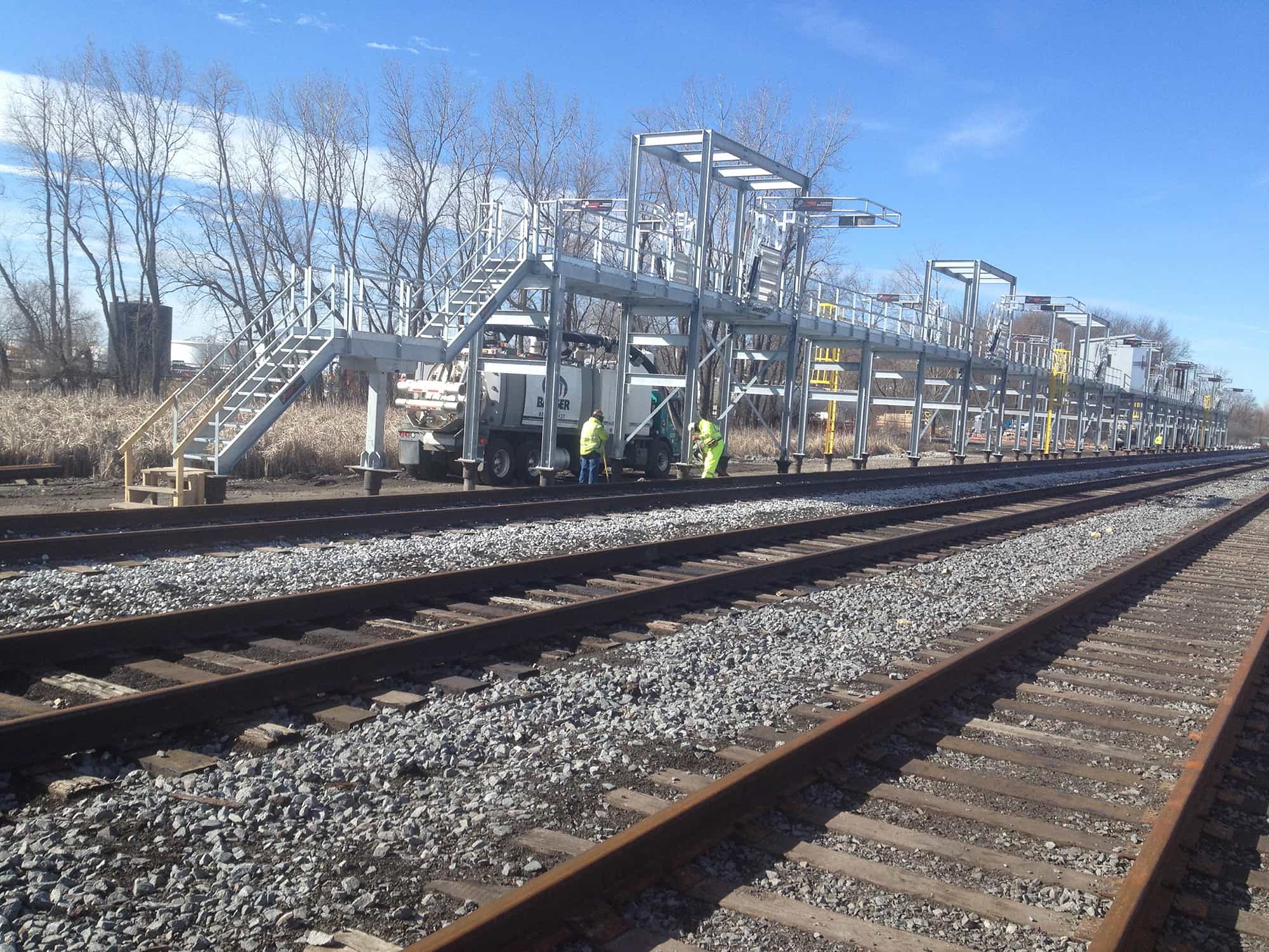 a train track with a staircase on the side of it