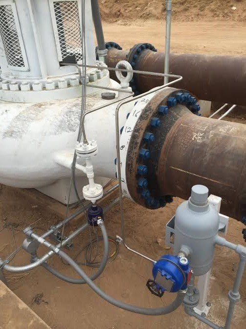 a close up of a pipe with a hose attached to i.