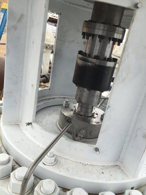 a close up of a machine with a hose attached to it.