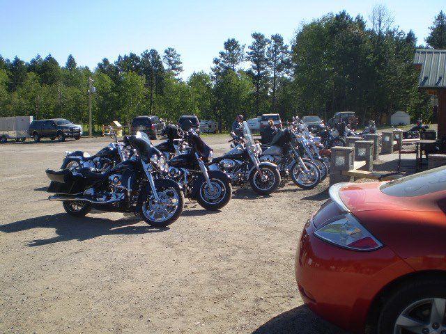 Classic motorcycles parked in an open space