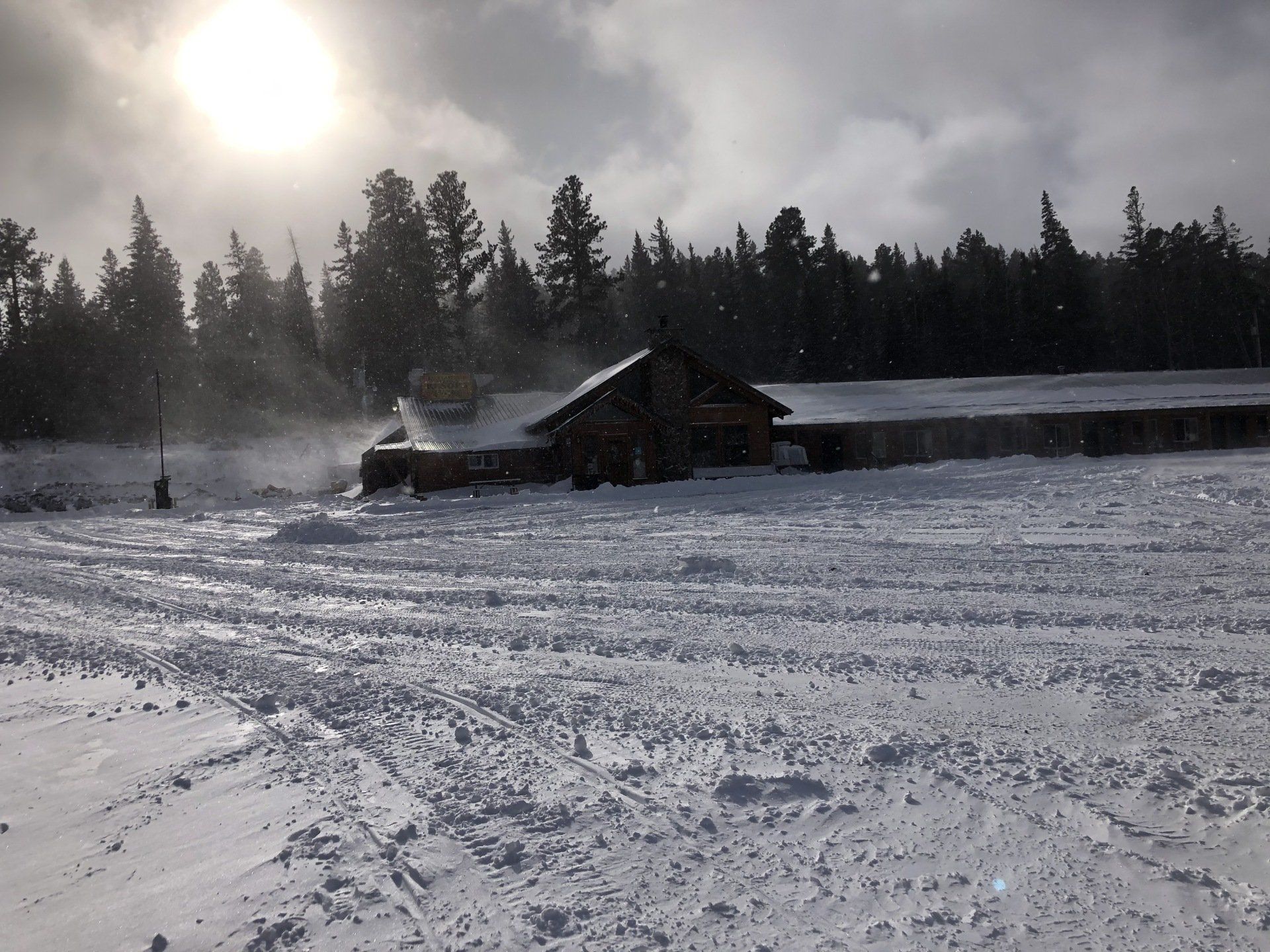 Two people riding a 2 seater snowmobile