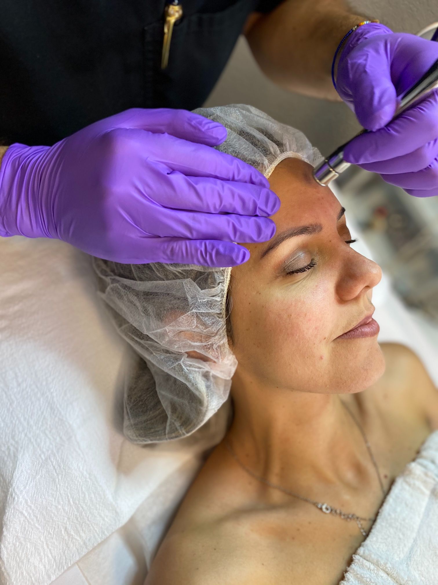 A woman getting microdermabrasion