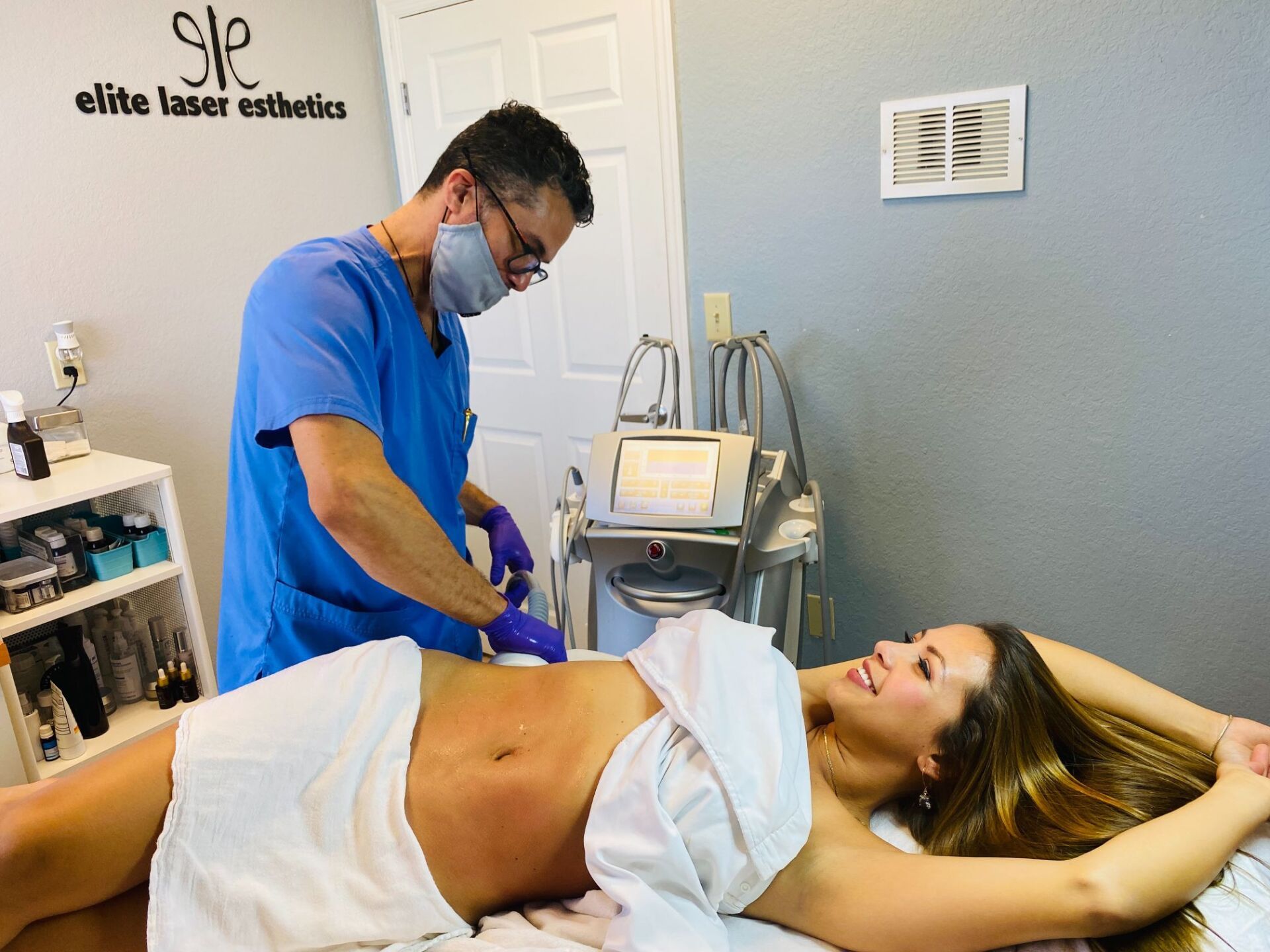 Woman receiving a body treatment  at Elite Laser Esthetics