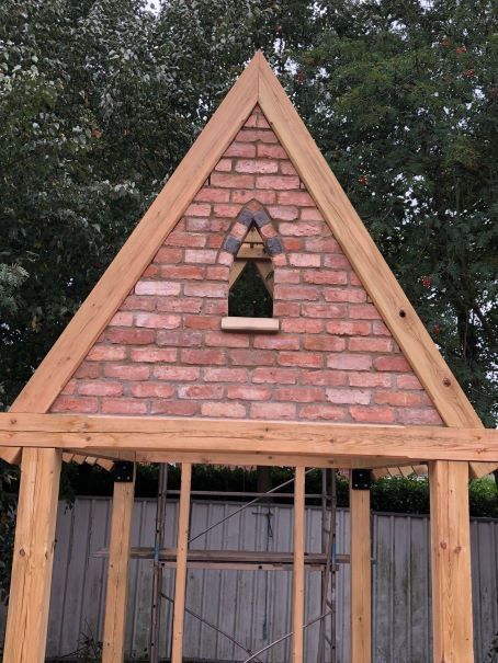 Ornate brickwork gable on gate house by buildjunky.com