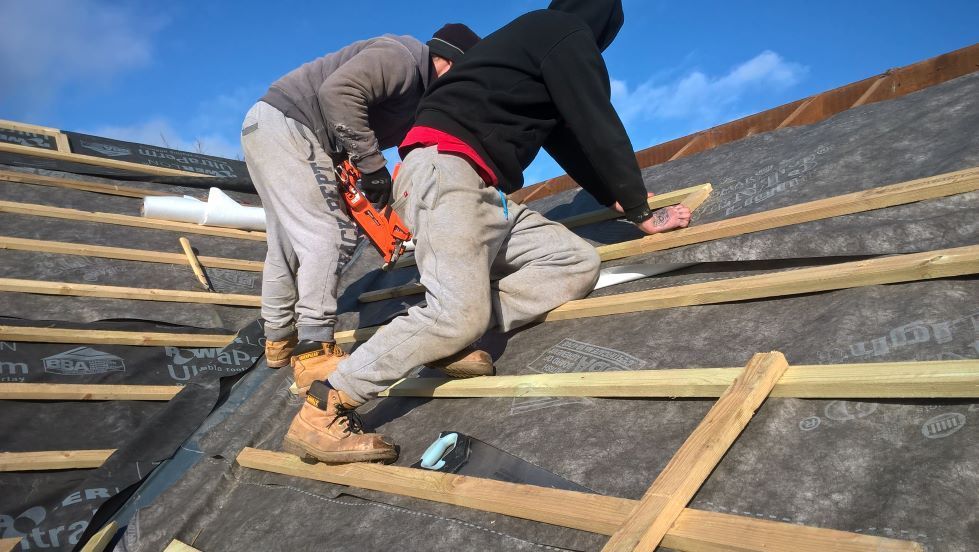 bungalow refurbishment new roof extension cement render finish underfloor heating large timber planter floating corner bi-folding doors