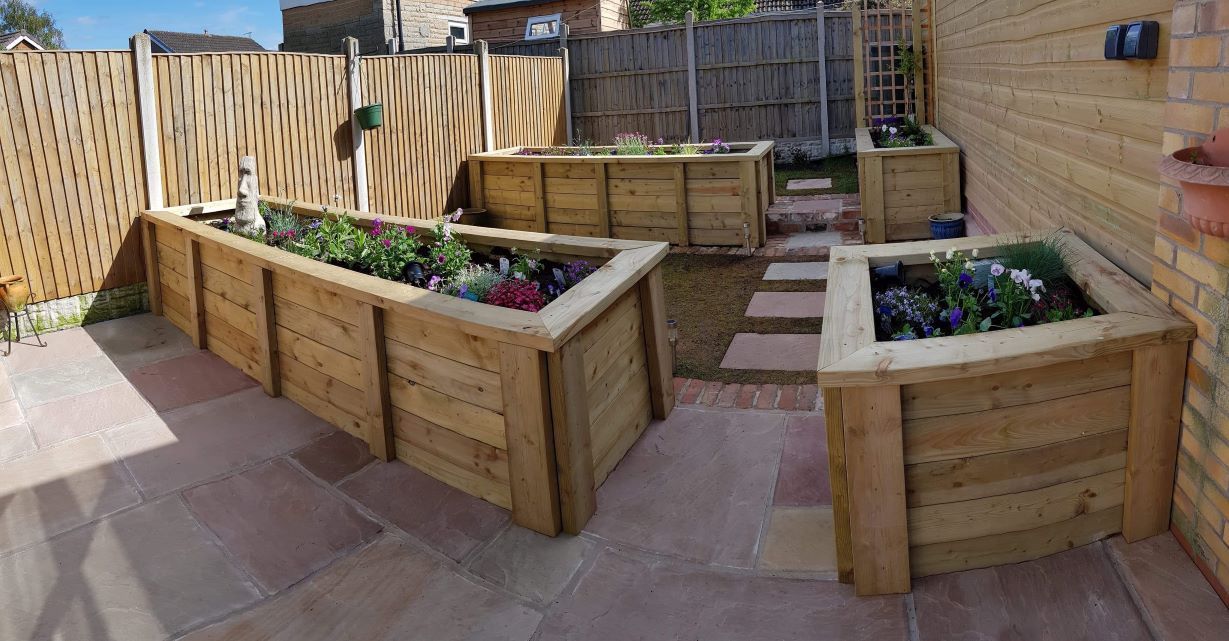 raised planters & patio in small garden  by buildjunky.com