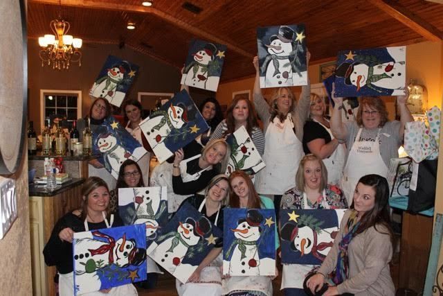 paint class holding christmas paintings