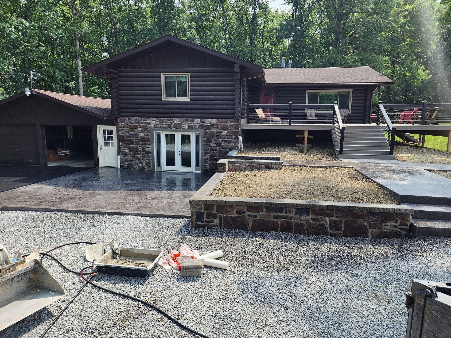 A large house with a lot of gravel in front of it.