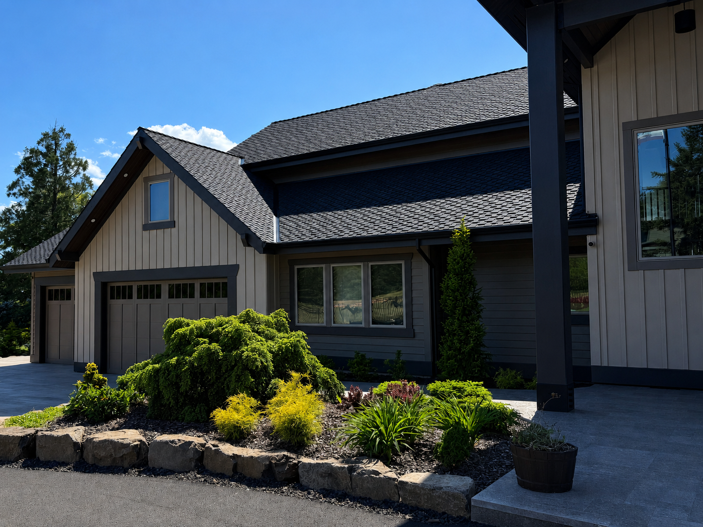 Custom home exterior with landscaped front entry and modern Pacific Northwest design.