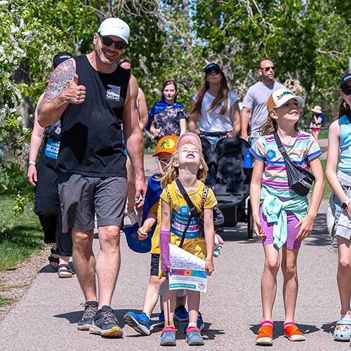 A little boy crossing his arms outside at last year's walk