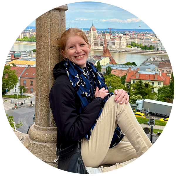 Hailey, a CF community member, sits overlooking a beautiful European city. 