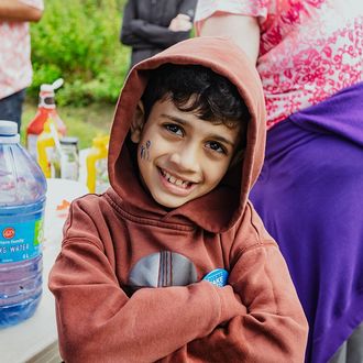 A little boy crossing his arms outside at last year's walk