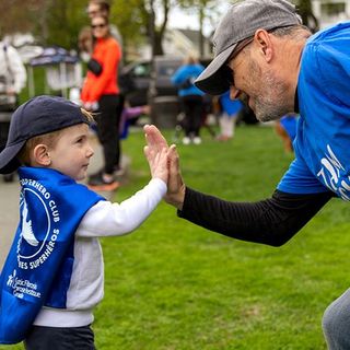 A Walk Jr. participant giving his dad a high five.