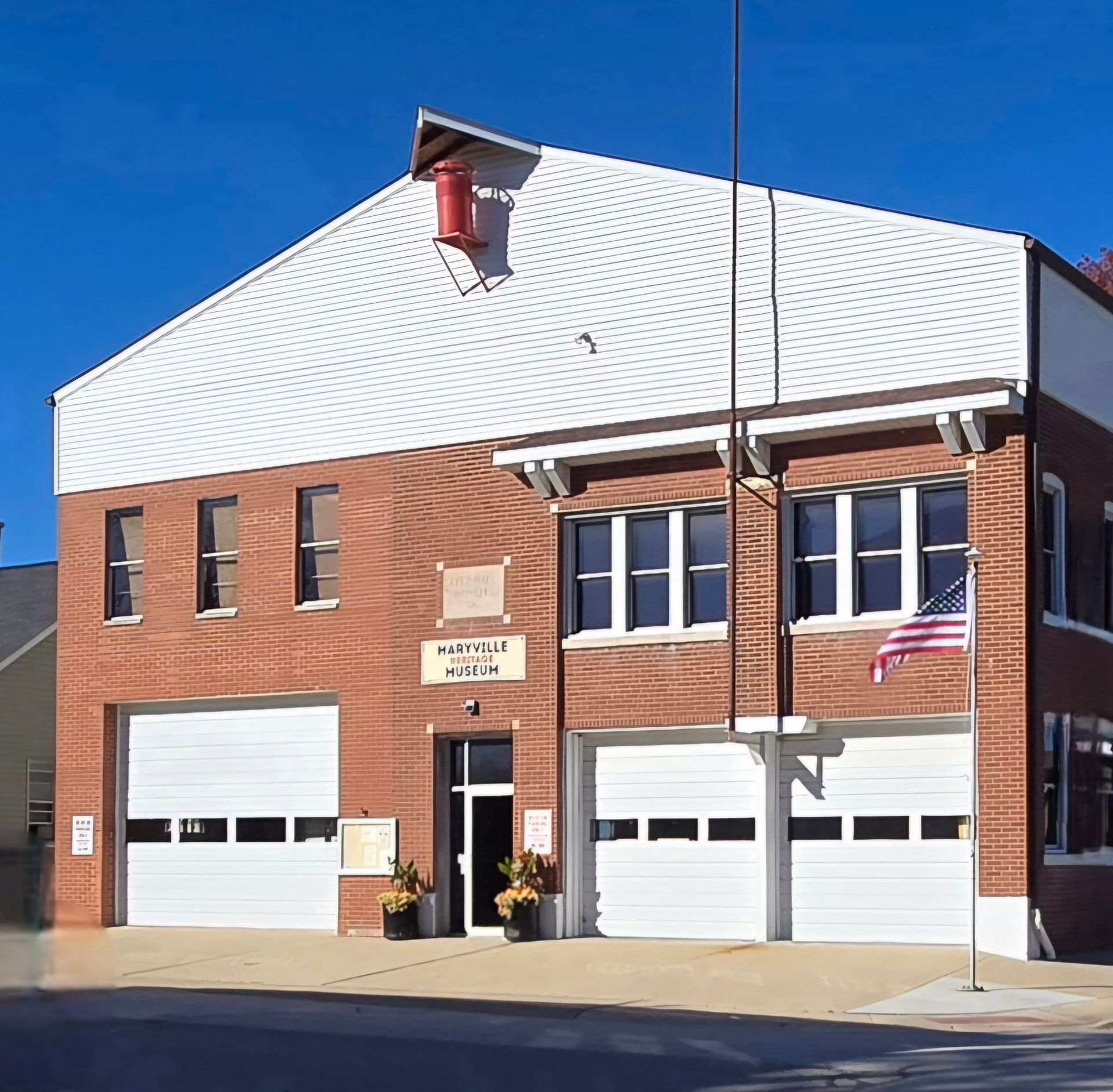 Black truck with Timber Source logo parked outdoors. Company information on side and back.