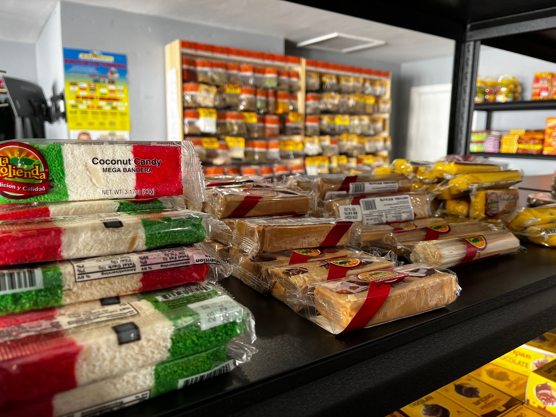 A shelf filled with lots of different types of food in a store.