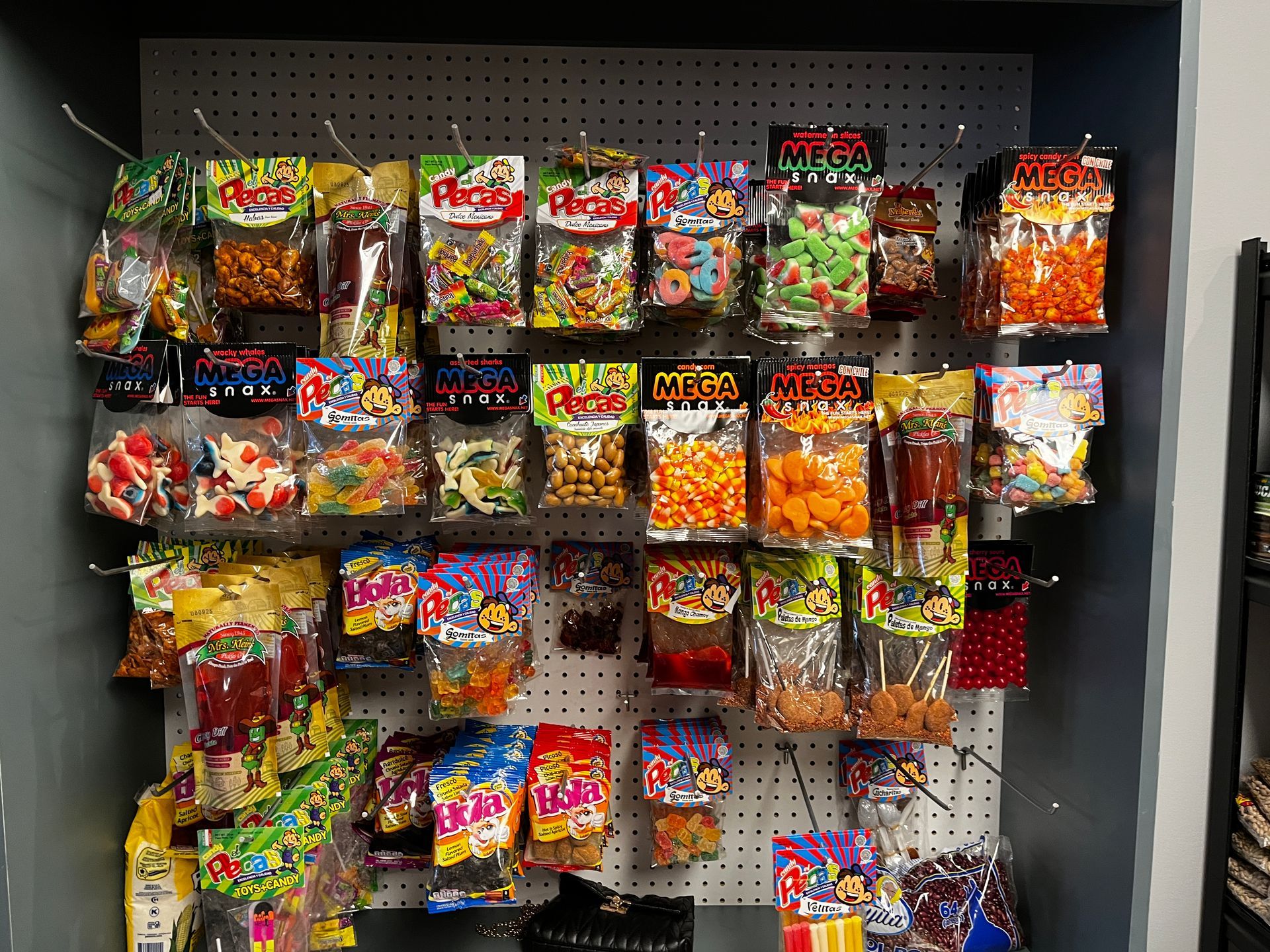 A wall filled with bags of candy and snacks.