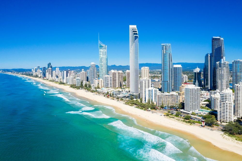 An Aerial View Of A City With A Beach And A City Skyline — Miami Denture Clinic In Broadbeach, QLD