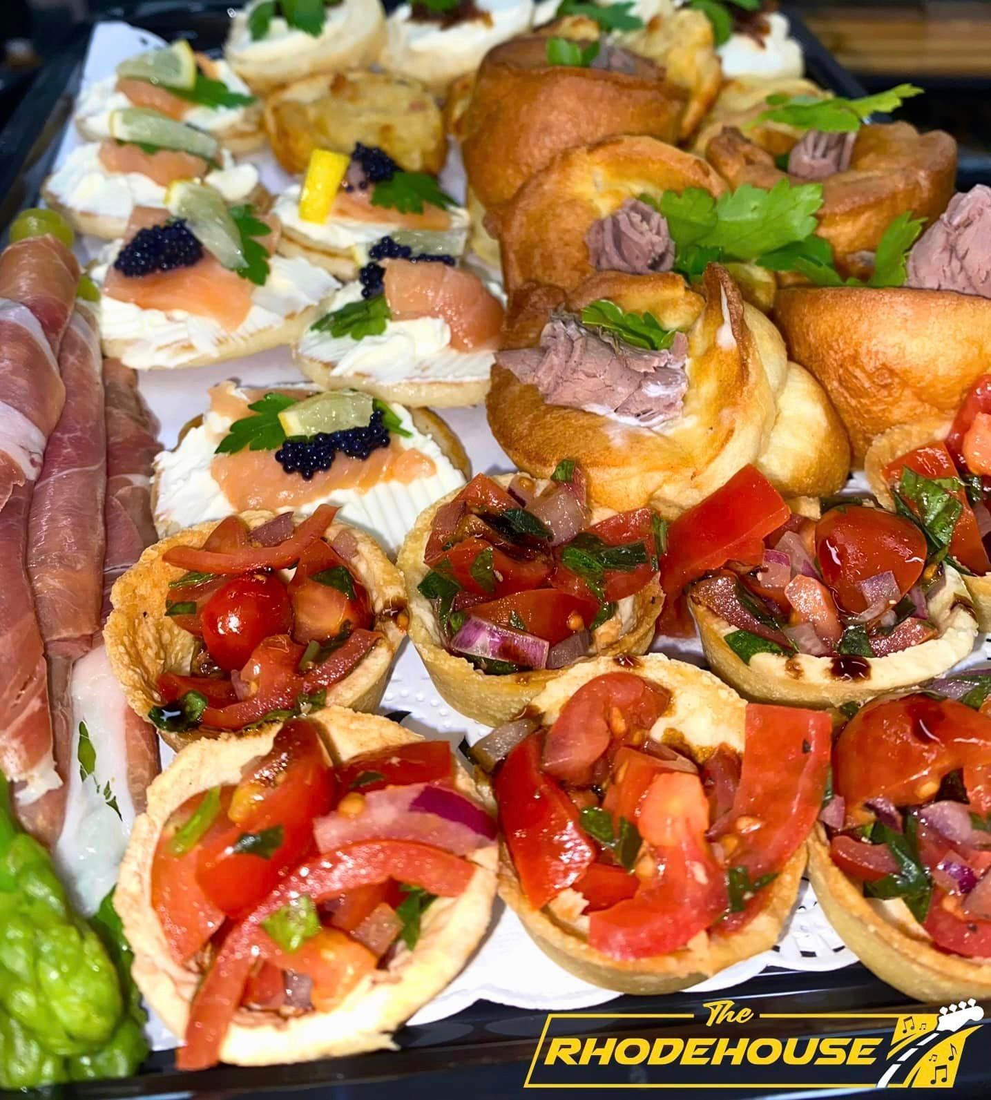 A tray of food with the word rhodehouse on it