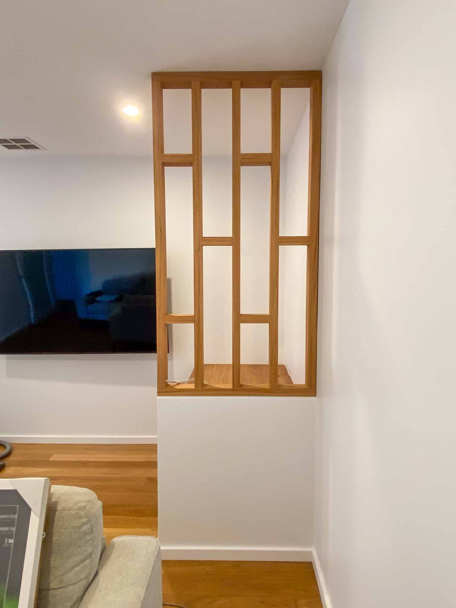 Evamill Construction custom timber screen in living room