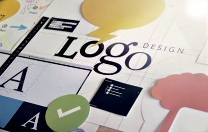 Man is Standing in Front of a Large Printer Holding a Piece of Paper — Classic Design & Print in Svensson Heights, QLD