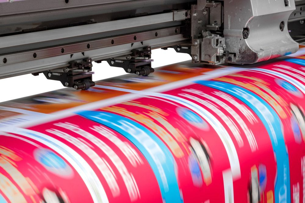 Large Sheet of Paper is Being Printed on a Machine — Classic Design & Print in Bundaberg, QLD