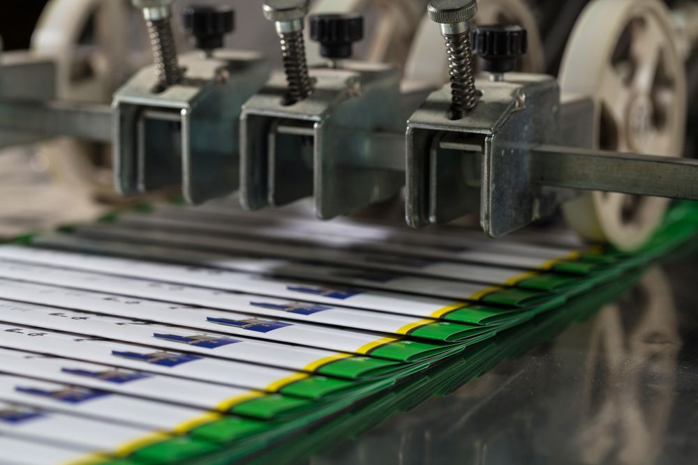 Machine is Cutting a Piece of Paper on a Table — Classic Design & Print in Svensson Heights, QLD