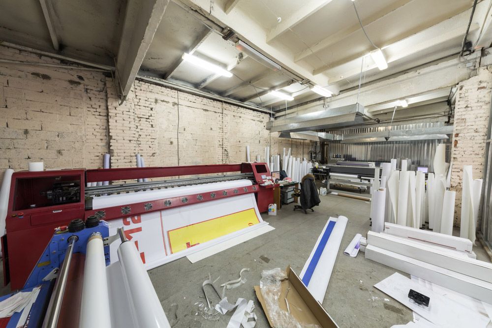 There is a Large Printing Machine in the Middle of the Room — Classic Design & Print in Bundaberg, QLD