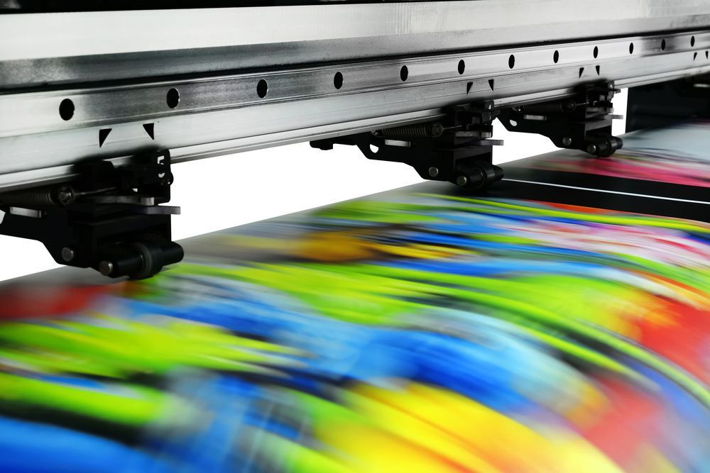 Printer is Printing a Colourful Image on a Piece of Paper — Classic Design & Print in Bundaberg, QLD