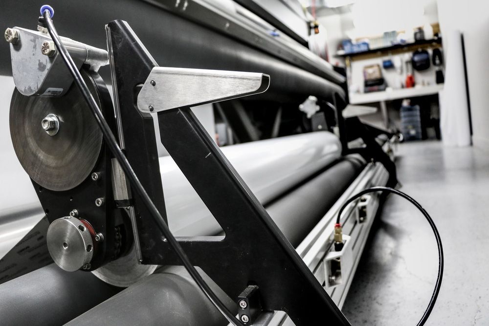 Close Up of a Machine With a Hose Attached to It — Classic Design & Print in Bundaberg, QLD