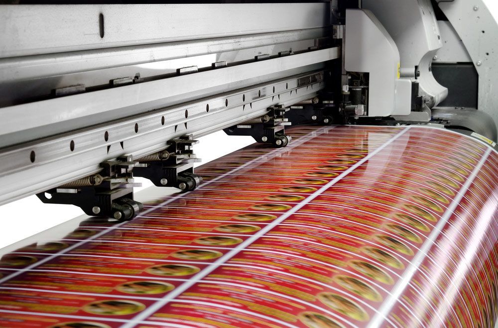 Large Printer is Printing a Large Sheet of Paper — Classic Design & Print in Bundaberg, QLD