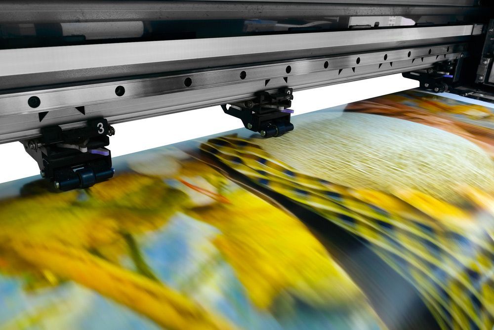 Close Up of a Printer Printing a Picture of Yellow Flowers — Classic Design & Print in Bundaberg, QLD