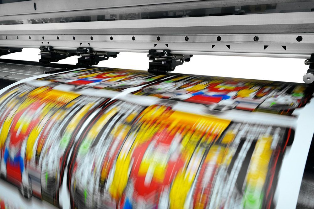 Printing Machine is Printing a Colourful Sheet of Paper — Classic Design & Print in Bundaberg, QLD